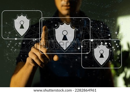 Businessman using shield protect icon, virtual screen interface, data protection cyber security privacy business, data personal and network information technology, digital protection privacy concept