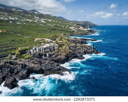 Aerial View at San Andres village near Los Sauces at northeast of La Palma Island. Green Volcanic Hills, and the Coast of the Atlantic Ocean. Canary Islands, Spain.  Royalty-Free Stock Photo #2282873371