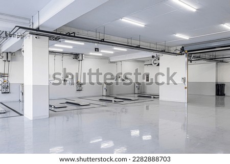 New car repair center. Empty car repair center. Interior of empty car dealership. Royalty-Free Stock Photo #2282888703