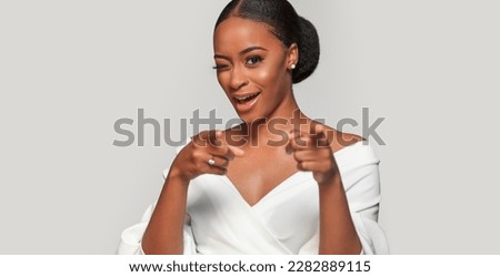 Beautiful black skin african american girl. Emotional portrait of a unpleasantly surprised woman. Wow big discounts. Sale advertising template with copy space.