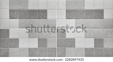 modern grey stylish texture of graphical tile background contains dots, lines, stripes, oblique pattern. repeating geometric tiles, close up view, for interior wall and floor finishing.