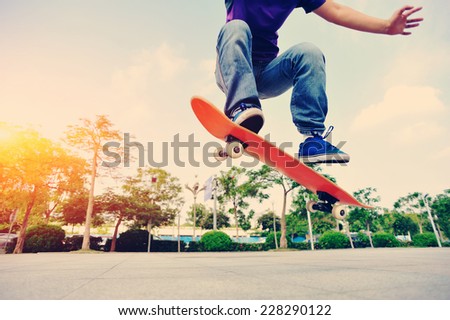 woman skateboarder skateboarding at city 