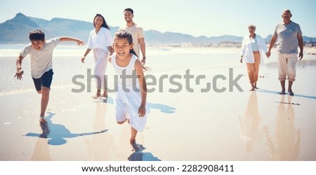 Beach, big family and kids running, playing and walking on ocean sand together in Mexico. Fun, vacation and happy men and women with children bonding, quality time and summer adventure in nature. Royalty-Free Stock Photo #2282908411