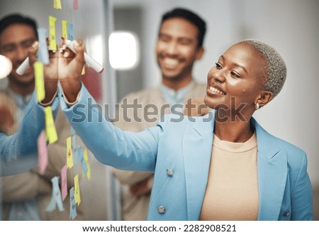 Businesswoman, planning and writing idea in meeting, calendar or agenda, sticky note or innovation. Idea, brainstorming and black woman leader with goal or problem solving, teamwork or solution Royalty-Free Stock Photo #2282908521
