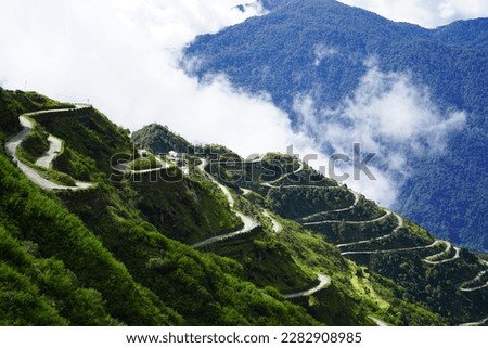 Zig Zag Road with Green Nature view of Old Silk Route Sikkim Royalty-Free Stock Photo #2282908985