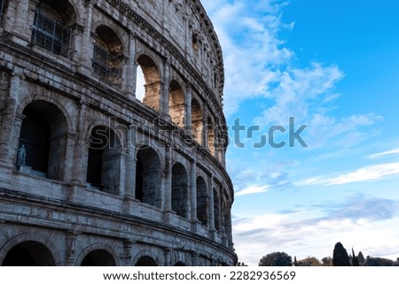 Panoramic view on exterior facade of famous Colosseum (Coloseo) of city of Rome, Lazio, Italy, Europe. UNESCO World Heritage Site. Flavian Amphitheater of ancient Roman Empire. Concept tourism