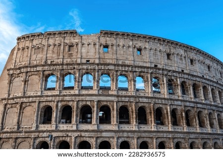 Panoramic view on exterior facade of famous Colosseum (Coloseo) of city of Rome, Lazio, Italy, Europe. UNESCO World Heritage Site. Flavian Amphitheater of ancient Roman Empire. Concept tourism