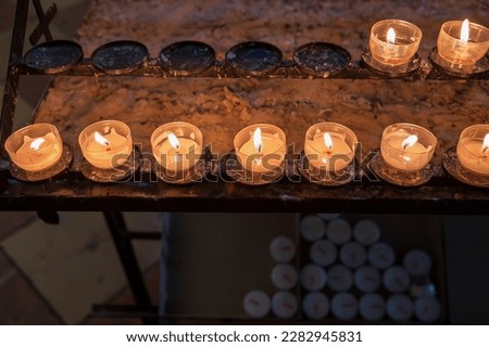 serie of candles in a church