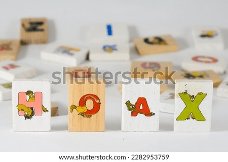 The word hoax, which is formed from colourful letters printed on wooden blocks for children's games, can be used as a concept.