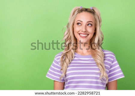 Photo of adorable girl with curly hairdo dressed striped t-shirt look empty space dental clinic ad isolated on green color background Royalty-Free Stock Photo #2282958721