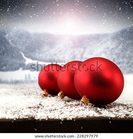 red balls with landscape of winter and sun 