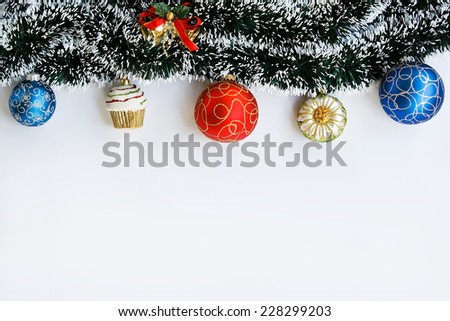 Decoration of garland and Christmas balls on light background with space for text