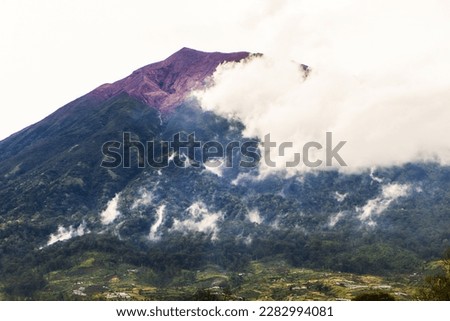 Mount Kerinci (Gunung Kerinci) is the highest mountain in Sumatra, the highest volcano and the highest peak in Indonesia with an altitude of 3805 masl, located in the Kerinci Seblat National Park area Royalty-Free Stock Photo #2282994081