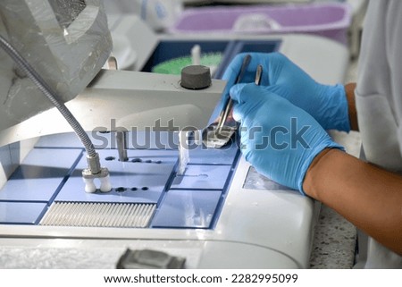 A pathologist is preparing a pathological biopsy for laboratory diagnosis of pathology. Royalty-Free Stock Photo #2282995099
