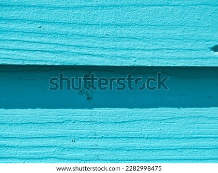Simple pale blue painted wood grain boards for simple back drop to add text to. Plenty of copy space available.