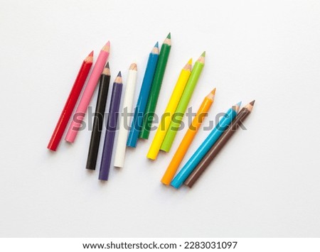 Bunch of fun mini colored pencils isolated on white. Multicolor group of cute small wooden pencils Royalty-Free Stock Photo #2283031097