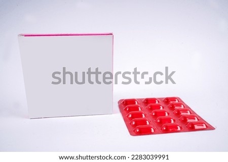 The blister pack is full of multi-colored tablets. A pack of full-color pills. Pharmaceutical blister pack.                      