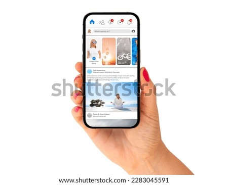 Phone in hand with social media app mockup on it's screen