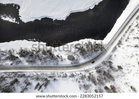 Road next to frozen river
