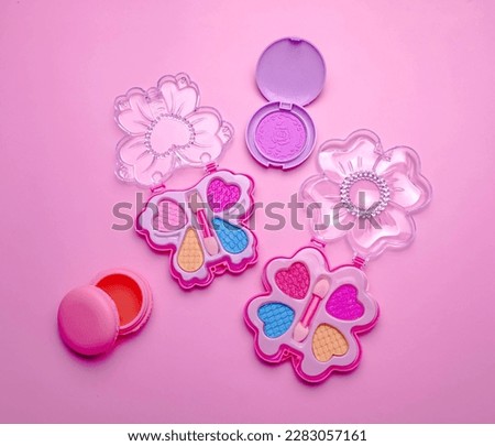 Children's set of decorative cosmetics for a little girl. Flat lay. Royalty-Free Stock Photo #2283057161