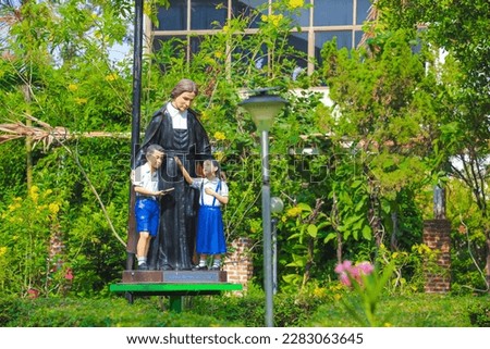 Saint john the baptist de la Salle with Student catholic religious statue Royalty-Free Stock Photo #2283063645