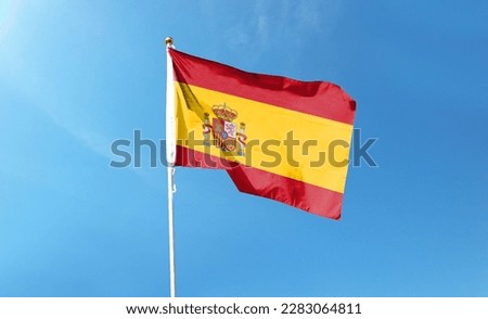 Spanish flag in the cloudy sky. waving in the sky Royalty-Free Stock Photo #2283064811