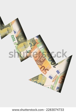 Concept arrow going down for stock trading with euro banknotes. Losing money. Top viw.