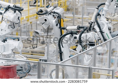 Robotic arm on a production line in a car factory