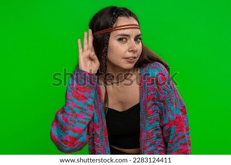 I cant hear you. What. Young woman trying hear, looking confused, frowning, keeping arm near ear for louder voice, asking to repeat, to hear information, deafness. Girl on green chroma key background Royalty-Free Stock Photo #2283124411