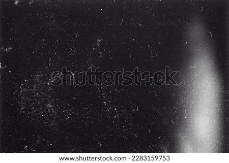 Blank grained film strip texture background with heavy grain, dust and ligth leak