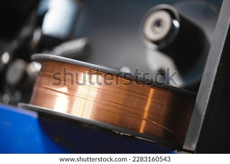Brazen welding wire close up background. Royalty-Free Stock Photo #2283160543