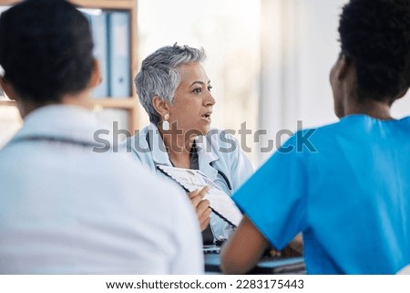 Meeting, hospital and team of doctors with documents for medical strategy, diagnosis and treatment. Healthcare, teamwork and group of health workers in discussion for insurance, planning and surgery Royalty-Free Stock Photo #2283175443