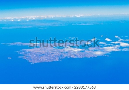 Lemnos island and Türkiye or Turkey mainland in the distance seen from flying airplane over the northern Aegean Sea.Picture taken September 4th,2013