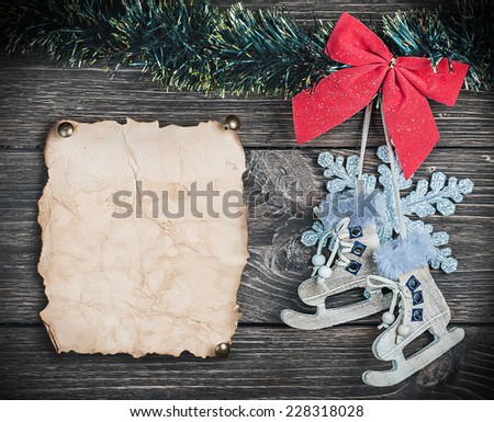 Christmas toys and old Paper the on wooden background