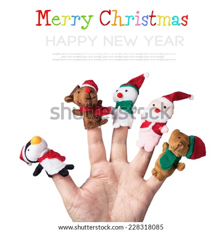 Christmas toys put on a hand on a white background. The text serves as an example and can be easily removed