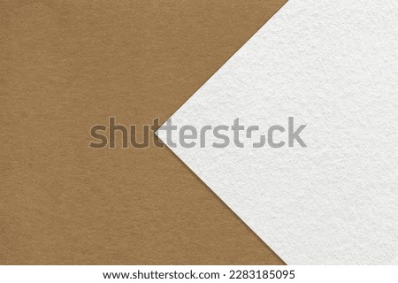 Texture of brown paper background, half two colors with white arrow, macro. Structure of dense craft beige cardboard. Felt abstract backdrop closeup. Royalty-Free Stock Photo #2283185095