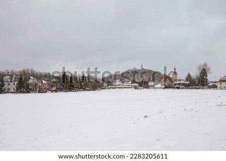 Church in village, winter landscape photo