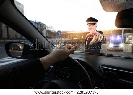 policeman in unifiorm stops a road pirate
