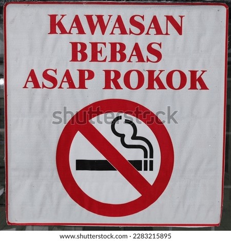 Smoke free zone. Sign with no smoking symbols. Indonesia. 