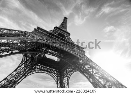 An abstract view of an Eiffel Tower against Sun in black and white colors, Paris, France