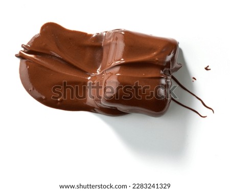 piece of melted chocolate isolated on white background, top view Royalty-Free Stock Photo #2283241329