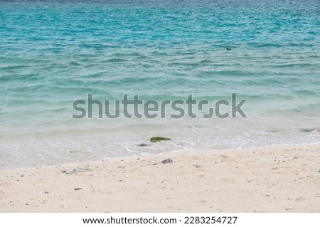 Blue waves crashing on the beach.