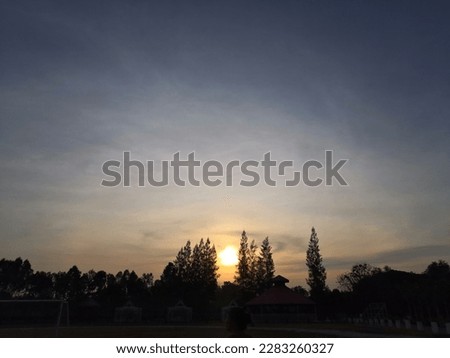 The picture depicts a sky with shades of orange. The sun might have either just risen or just set, as the orange color indicates the presence of sunlight in the sky.