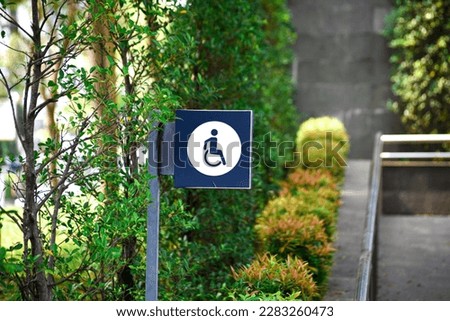 Vertical sign for disabled people, detail of information sign, facilities for people