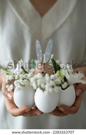 Composition with Easter decor. Easter eggs and Easter bunny rabbits
