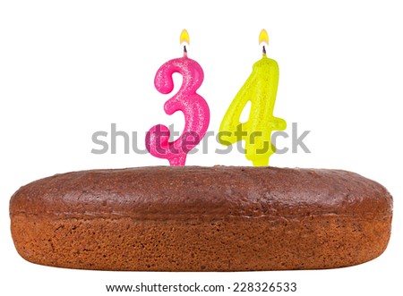 birthday cake with candles number 34 isolated on white background