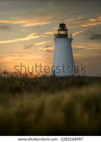 Fayerweather light at sunset in Bridgeport, CT. Royalty-Free Stock Photo #2283268987