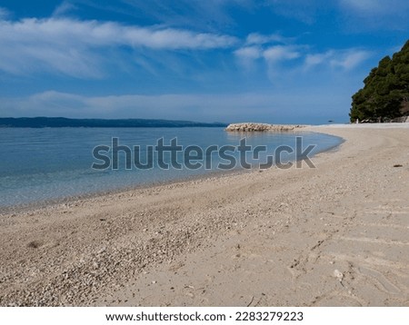sandy beach, blue sea and sky