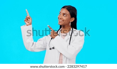 Healthcare doctor, studio and happy woman point at medical promotion, hospital notification or clinic announcement mockup. Nurse portrait, advertising surgeon and marketing person on blue background