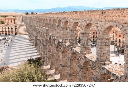 Tourism at Segovia,  Roman aqueduct on plaza del Azoguejo in Spain Royalty-Free Stock Photo #2283307247